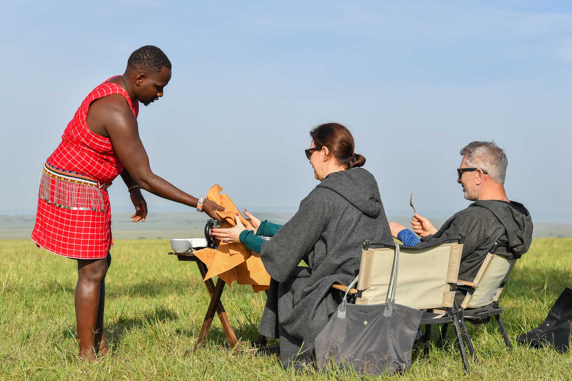 A bush breakfast laid out under a tree in the Masai Mara