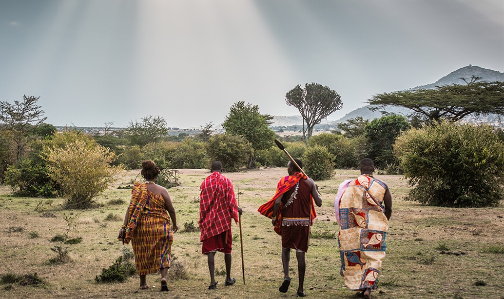 Maasai men in red shukas standing together